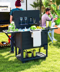 104 Quart Outdoor Cooler On Wheels With Bottle Opener And Shelves Rolling Ice Chest For Pool Decks Poolside Parties BBQs And Backyard Hangouts Built In Divider For Separate Drinks And Fruit Black used at a backyard party