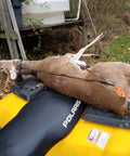 Deer secured with self-locking block and tackle hoist system on ATV, showing ease of transport.