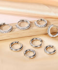 Stainless Steel Earring Set For Women, 10 Pairs, Includes Small Huggie Hoops, CZ Studs, And Glossy Spherical Studs, Versatile Stainless Steel Jewelry For Everyday Piercing Looks. Silver CZ huggie hoops and plain stainless steel hoops