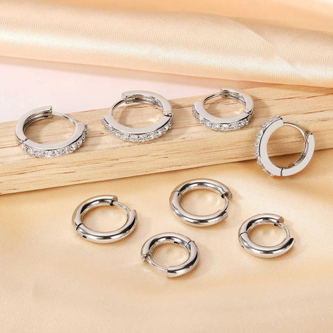 Stainless Steel Earring Set For Women, 10 Pairs, Includes Small Huggie Hoops, CZ Studs, And Glossy Spherical Studs, Versatile Stainless Steel Jewelry For Everyday Piercing Looks. Silver CZ huggie hoops and plain stainless steel hoops