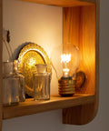 Cordless USB Rechargeable LED Light Bulb Lamp With Vintage Edison Glow on wooden shelf, soft warm ambient lighting