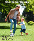 Man and child playing soccer in the park, highlighting 2K QHD quality with clear details.