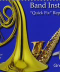 Hassle Free School Band Instrument Quick Fix Repair Guide cover featuring brass instruments and repair tools.
