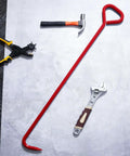 36 Inch Manhole Cover Hook Set Of 4 With 5/8 Hex Drive Handle nearby tools including hammer, wrench, and pliers on gray surface.