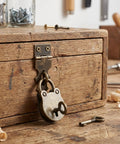 Two Sets Antique Bear Shaped Hasp Lock With Keys For Jewelry Boxes, Wooden Cases, And Gift Boxes on a wooden chest