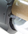 Close-up of die-cast aluminum and polycarbonate body on a Rugged Heavy Duty Pneumatic Filter For 1 Inch Pipe Size That Keeps Water And Particles Out Of Your Compressed Air Built To Last Die Cast Aluminum And Polycarbonate Body 40 Micron Bronze Element Max 150 PSI Up To 120 Degrees Fahrenheit, showcasing the 40 micron bronze element inside the transparent housing.
