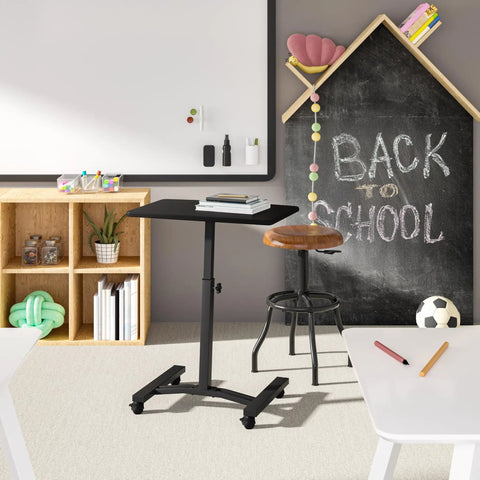 On Wheels Height Adjustable Laptop Desk For Home Office And Classroom Use, wooden surface, in a classroom setting with school supplies.