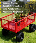 Red wire mesh cart with solid tire set for hand trucks and wheelbarrows with ten inch flat free tires size four point one zero by three point five zero four five eighths inch axle bore two point two inch hub offset includes adapter kit two pack, carrying potted plants, in a garden setting.