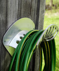 Heavy Duty Aluminum Hose Holder Wall Mount For Outdoor Gardens 200 Foot Reel For Half Inch Hoses mounted on exterior wall