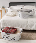 50L Laundry Hamper Set With Built In Comfort Handles 3 Pack White Plastic Baskets With Ventilation Holes For Closet Dorm Laundry Room Go To Easy Lift Large Capacity For Quick Organized Laundry on bed and rug loaded with folded clothes.