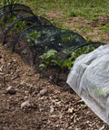 Garden Insect Mesh Netting For Plants And Patio Durable Mosquito Barrier Screen Large 9.84 By 13.12 Feet Black installed on garden plants.