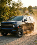 Trail Blade MTS Mud Terrain Radial Tire For Light Trucks And Jeeps, 35X13.50R24LT in action on gravel road with SUV