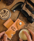 Five In One Survival Hatchet Head with skinner ulu hammer ripper gut hook, leather sheath, axe wax, and hand applying balm