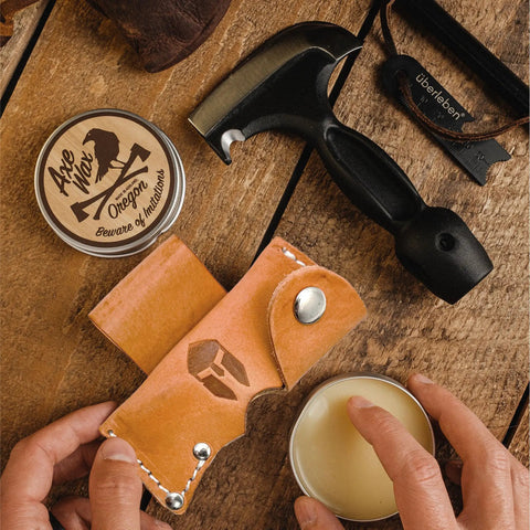 Five In One Survival Hatchet Head with skinner ulu hammer ripper gut hook, leather sheath, axe wax, and hand applying balm
