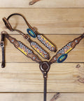 Custom Western Leather Headstall And Breast Collar Tack Set Showcasing Fire Painted Finish with leaf carving on wood background.