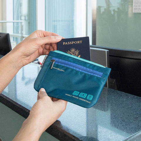 World Travel Essentials Dual RFID Passport And Currency Organizers With Colorful Zippers at airport desk