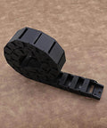 Two Pack Nylon Drag Cable Chains 18x37mm Semi Closed Wire Carriers coiled on brown surface