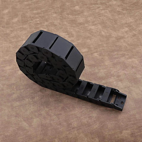 Two Pack Nylon Drag Cable Chains 18x37mm Semi Closed Wire Carriers coiled on brown surface
