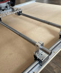 Dead On Precision Router Sled For Wood Slab Flattening Mill showing heavy duty 20mm steel tracks and acrylic mounting plate.