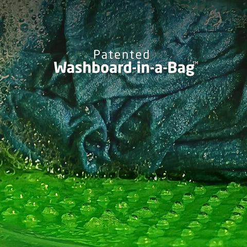 Close-up of the Heavy Duty Travel Laundry Sack Featuring Slick Inner Washboard Grooves with bubbles and water for cleaning.