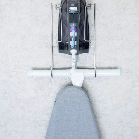 Super Handy Ironing Board Holder Wall Mount For Laundry Room Keeps Iron And Board Together In One Easy To Reach Space Saving Wall Or Door Mount For Quick Laundry Day Setup, top view of chrome holder with iron and board attached on wall.