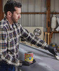 Man applying Liquid Rubber Coating Sealant You Can Brush Roll Dip Or Pour For Waterproof Flexible UV Resistant Coating On Roofs