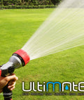 Heavy Duty Metal Fireman Hose Nozzle with Seven Spray Patterns High Pressure Garden Sprayer in use watering lawn
