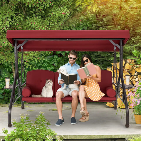 Couple lounging on Three Seat Outdoor Porch Swing With Adjustable Canopy Convertible Patio Swing Bed With Stand Glider Swing in Wine Red