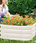 Person tending flowers in a 2x1ft galvanized raised garden bed, deep 12-inch bed with durable metal planter box and open bottom drainage.