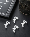 Top Shelf 12 Pack Of 1 Inch White Plastic Valance Clips For Window Blinds Lock In Your Trim With Zero Hassle This Straight Up Game Changer Delivers Heavy Duty Grip And Smooth Cleanup Every Single Time, featuring four clips on a dark surface.