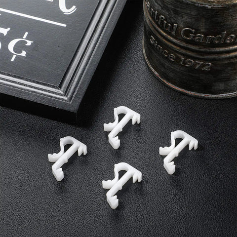 Top Shelf 12 Pack Of 1 Inch White Plastic Valance Clips For Window Blinds Lock In Your Trim With Zero Hassle This Straight Up Game Changer Delivers Heavy Duty Grip And Smooth Cleanup Every Single Time, featuring four clips on a dark surface.