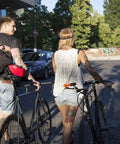Two people walking bicycles in an urban area, suitable for using Beefed Up Heavy Duty 12mm Hardened Manganese Steel Bike Chain Lock
