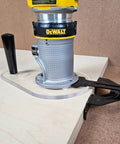 6X9 Router Base Plate In Clear Acrylic Sets A Dead On Fit For Dewalt Dwp611 And DCW600B with router on wood.
