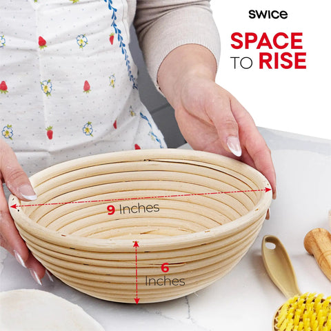 Person holding 9 inch round banneton proofing basket from Round 9 Inch Banneton Proofing Basket Starter Kit With Lame Dough Scraper Linen Liner And Basting Brush For Perfectly Shaped Sourdough Loaves All In One Bread Making Tools