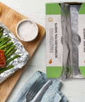 Premium Aluminum Foil Sheets 9 By 10.75 Inches, 1000 Sheets, Pop Up Dispenser, shown with grilled food on countertop