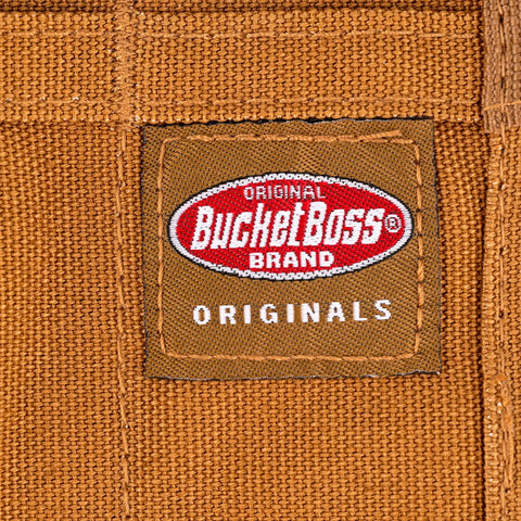 Close-up of Heavy Duty Tool And Wrench Roll With Eleven Pockets In Brown Canvas showing brand label stitching detail.
