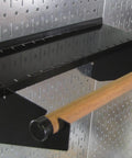 Pro-Grade Metal Pegboard Organizer System With Galvanized Panels And Black Accessories featuring a wooden rod attachment.