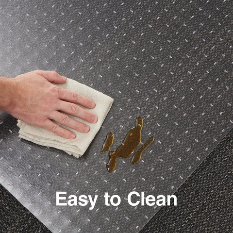 Person cleaning spill on Clear Office Chair Mat With Lip For Flat Pile Carpets Extended Under Desk Coverage 53 By 45 Inches No Slip Smooth Glide Vinyl Floor Mat Greenguard Gold Certified For Healthier Workspace