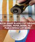 28mm Rotary Cutter Replacement Blades Set With 5 Tungsten Steel Blades cutting fabric with ruler visible