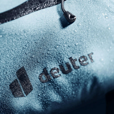 Close-up of blue waterproof material with logo detail on Cabezon FB 6 Frame Bag For Bikes, 6L Waterproof Storage Pack For Commuting And All Terrain Riding, Lightweight Yet Ride Ready Bike Bag With Reflective Trim, Quick Access Main Compartment Built For Road Gravel And MTB.