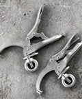 Bulletproof 9 Inch Drill Press Locking Clamp With Killer Jaw Tension For Hella Secure Workpiece Holding On Shop Benches Or Mobile Tool Cart Racks Two Pack, silver clamps on stone surface.