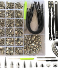 559 Piece Punk Studs And Spikes Kit with cone, square pyramid, circular rivets, wristbands, puncher, awl, and screwdriver displayed