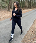 Person walking on path wearing Air Gel Ankle Stirrup Brace With Customizable Air And Gel Support And Cold Therapy For Targeted Stabilization And Pain Relief One Size Fits All For All Day Comfort