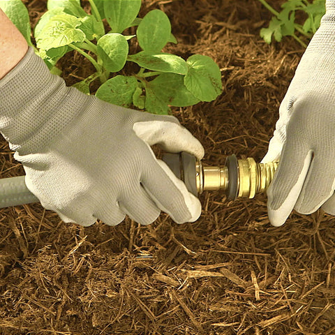 Hands installing a Brass Garden Hose Quick Connect Fitting For Hoses, Nozzles, And Sprinklers Easy Snap On Off Female Quick Disconnect