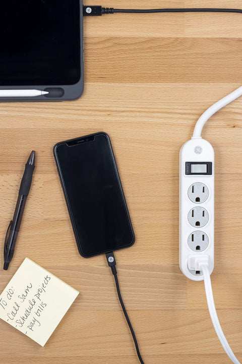 Four Outlet Power Strip With 1.5 Foot Extension Cord Twist To Lock Safety Covers Built In Circuit Breaker UL Listed White on desk