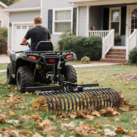 Rear view of ATV towing Beast Of A Tow Behind Landscape Rake For ATV And UTV 48 Inch Wide With 2 Inch Receiver 17 Heavy Duty Spring Steel Tines