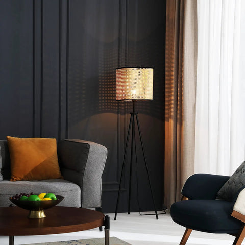Mid Century Bohemian Tripod Floor Lamp With PVC Rattan Shade And Velvet Rim next to a sofa in a living room