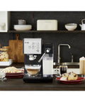 Super Sleek Programmable Espresso And Cappuccino Maker Featuring Automatic Milk Frother And 19 Bar Pump on kitchen counter with coffee drinks.