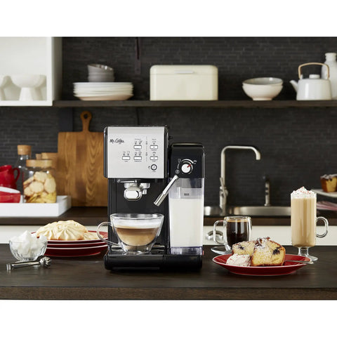 Super Sleek Programmable Espresso And Cappuccino Maker Featuring Automatic Milk Frother And 19 Bar Pump on kitchen counter with coffee drinks.