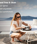 Woman using a Lightweight Portable Travel Laundry Bag With Patented Washboard Interior for quick cleaning while traveling.